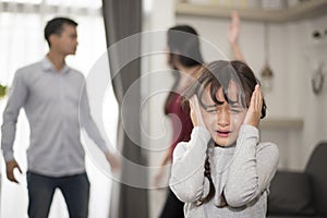 Little girl was crying because dad and mom quarrel, Sad and dramatic scene, Family issued, Children`s Rights abused in Early