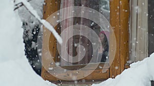 Little Girl Watching the Snow fall