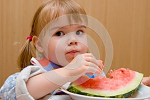 A little girl with watermelon