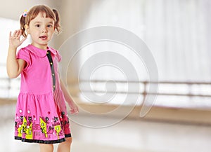 Little girl waving