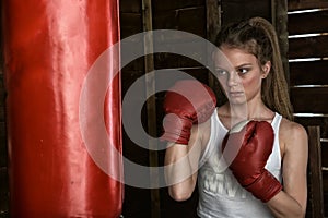 Little girl wearing  boxing gloves