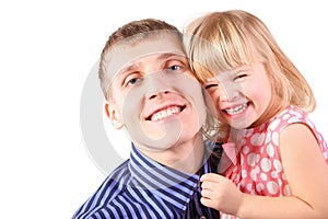 Little girl wearing dress is cuddle her father photo