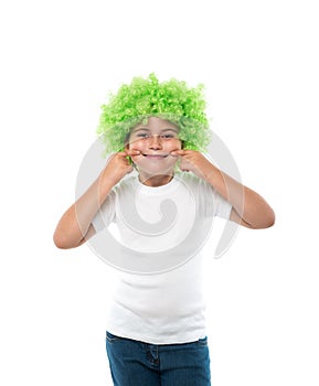little girl wearing green wig make herself laughing by hands