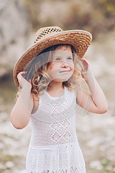 Little girl wearing a hat outdoors