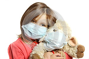 Little girl wearing a protective mask