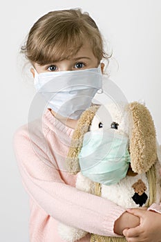 Little girl wearing a protective mask