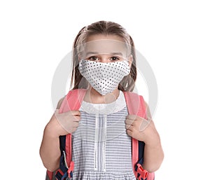 Little girl wearing protective mask with backpack on white background. Child safety