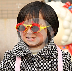 Little girl wearing sunglasses