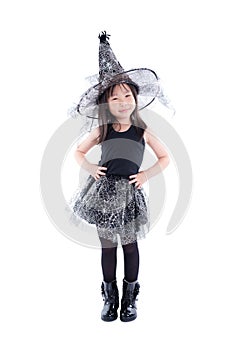 Little girl wearing witch costume for Halloween
