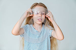 Little girl wears safety goggles shows language