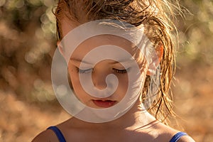 A little girl with wet hair