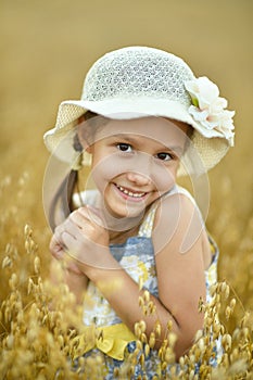 Little girl in wheat field