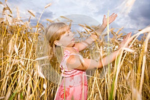 Little girl in a wheat field