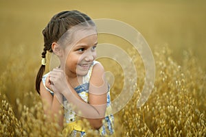 Little girl in wheat field