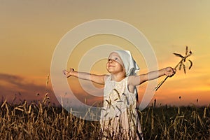 Little girl in wheat field