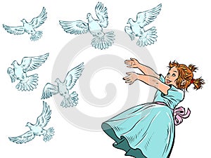 Little girl and white doves. A symbol of peace. Animals and children