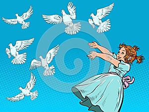 Little girl and white doves. A symbol of peace. Animals and children