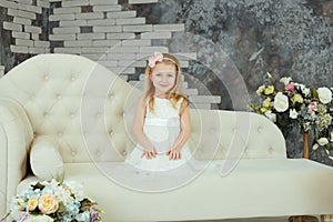 Little girl in white fashionable dress