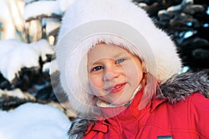 Little girl in a white fluffy hat