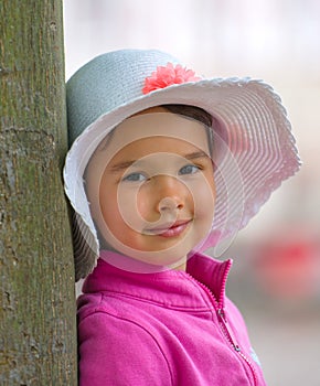 Little girl with white summer hat