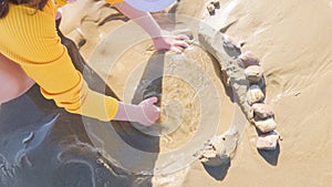 Little girl winter clamming at Pismo Beach