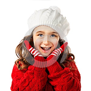 Little girl in winter clothing, think about Santa. Isolated background