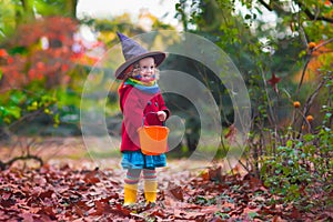 Little girl in witch costume at Halloween