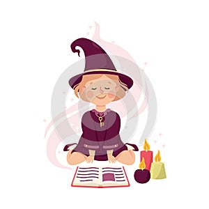 Little Girl Witch Wearing Purple Dress and Pointed Hat Practising Witchcraft and Doing Magic with Spellbook and Candles