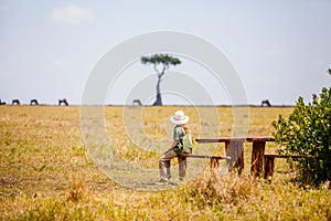 Little girl witnessing great migration in Kenya