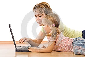 Little girl and woman with laptop