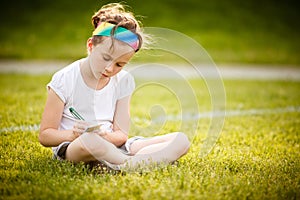 Little girl writing