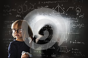 Little Girl Writing Blackboard Concept