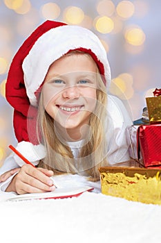 little girl writing a letter to Santa Claus