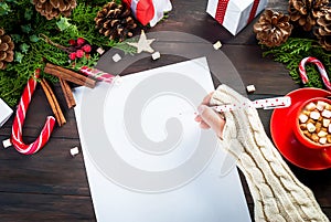 Little girl writing letter to Santa Claus at Ð¡hristmas