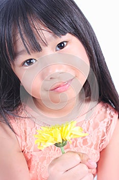 Little girl with yellow flower