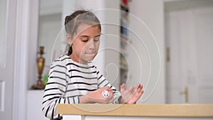 Little GirlChild Home On Sofa Playing With Pet Hamster. Concept of Friendship of children and Animals.