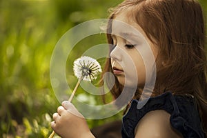 Little girll with dandelion