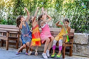 Little girls blowing bubbles