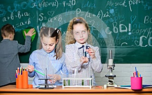 Little girls and boy in lab. Chemistry science. Little kids earning chemistry in school lab. Little children. Science