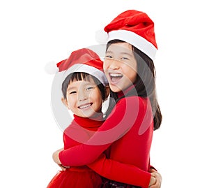 little Girls with christmas hat and Giving Another Hug