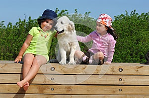 Little girls with a Golden retriever