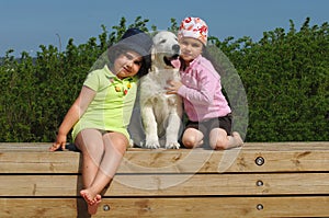 Little girls with a Golden retriever