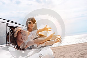 Little Girls happy traveling car travel enjoy holidays and relaxation. Hatchback Car travel driving road trip of family summer