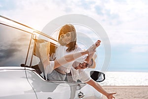 Little Girls happy traveling car travel enjoy holidays and relaxation. Hatchback Car travel driving road trip of family summer