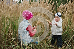 Little girls in high grass portrait