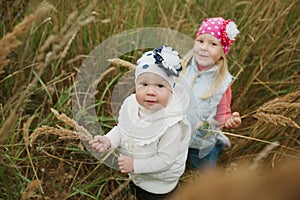 Little girls in high grass portrait