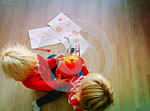 Little girls holding pumpkin, get ready for Halloween party