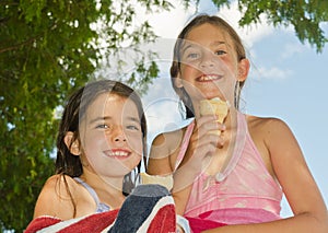 Little girls with an ice cream cones