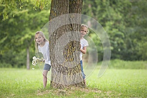 Little girls playing hide and seek