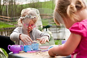 Little girls playing outdoors